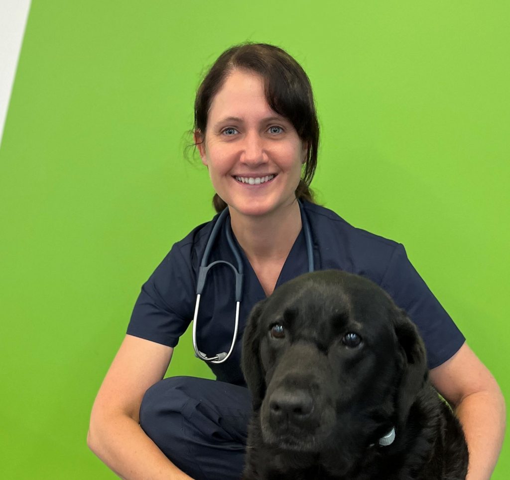 A portrait of Dr Lisa Smart with a dog