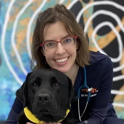 Portrait of Dr Nicole Kalnins with dog