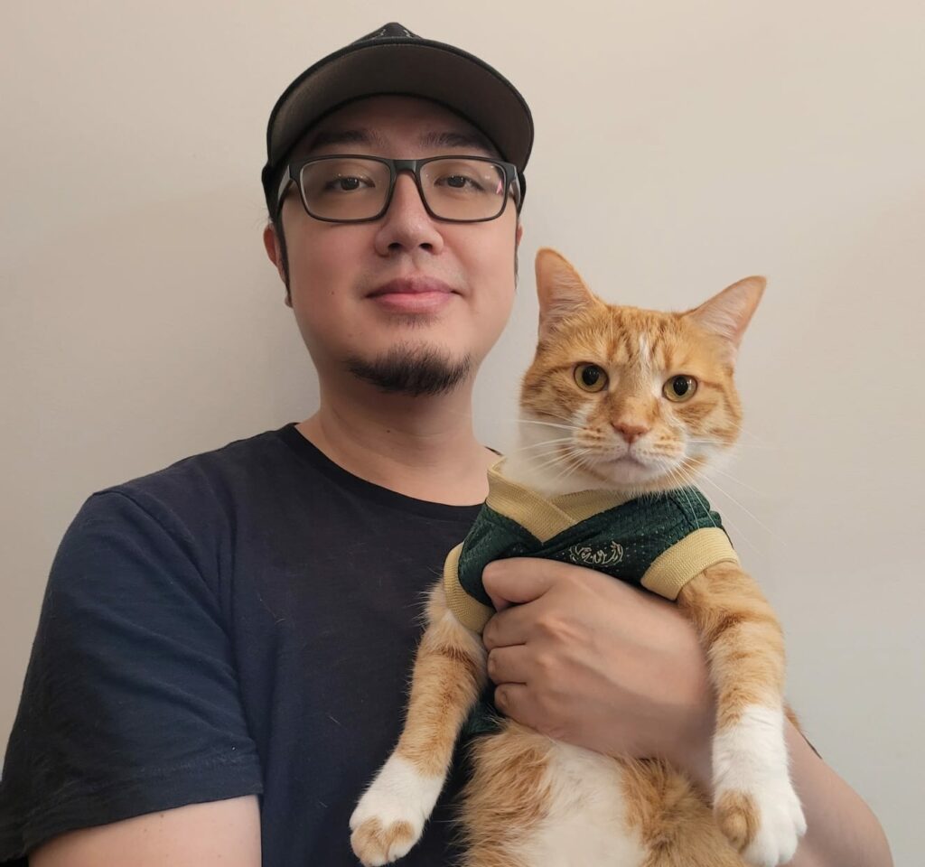 portrait of Dr Jason Chen and cat