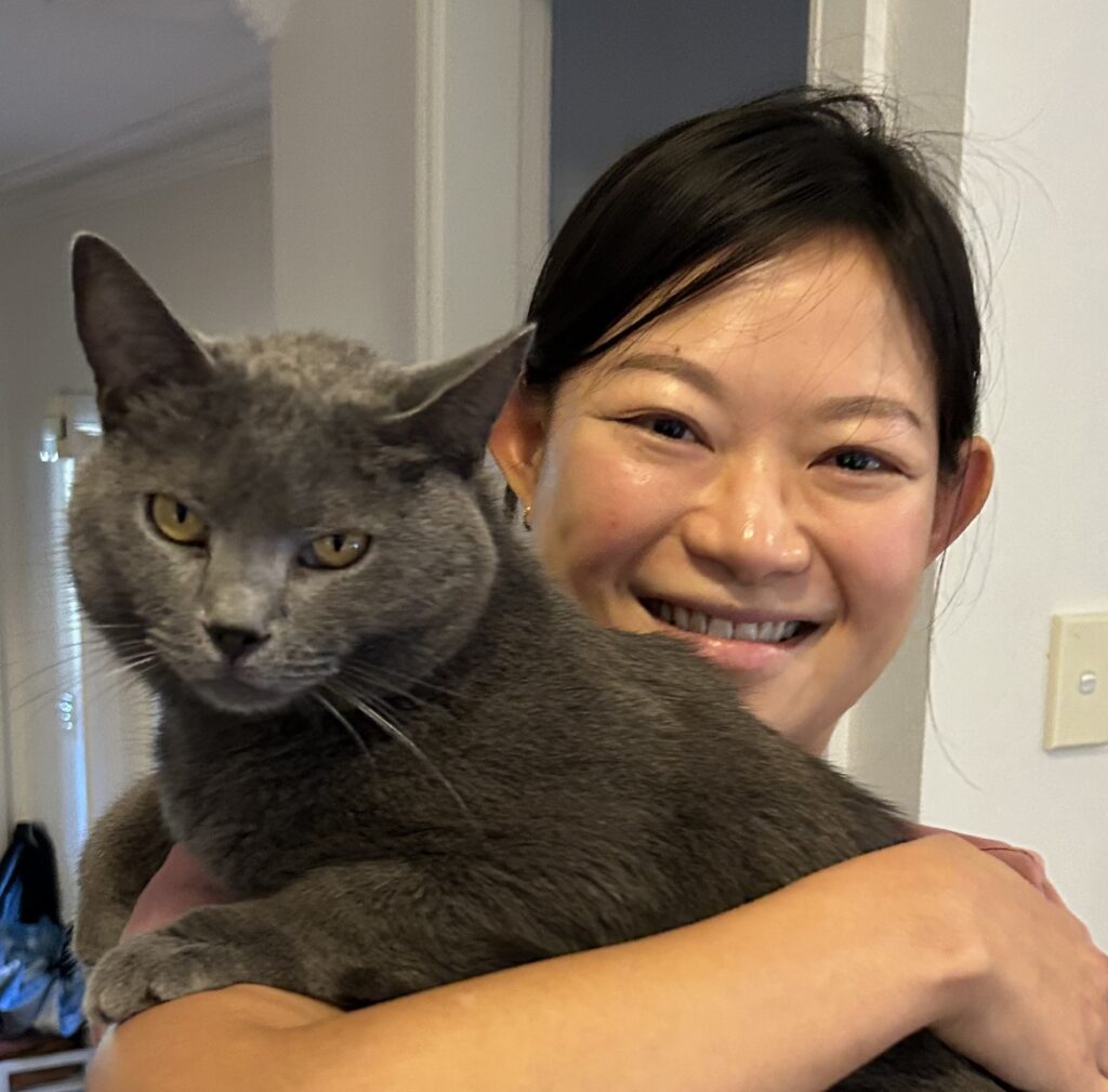 Portrait of Dr Iris Chan with cat
