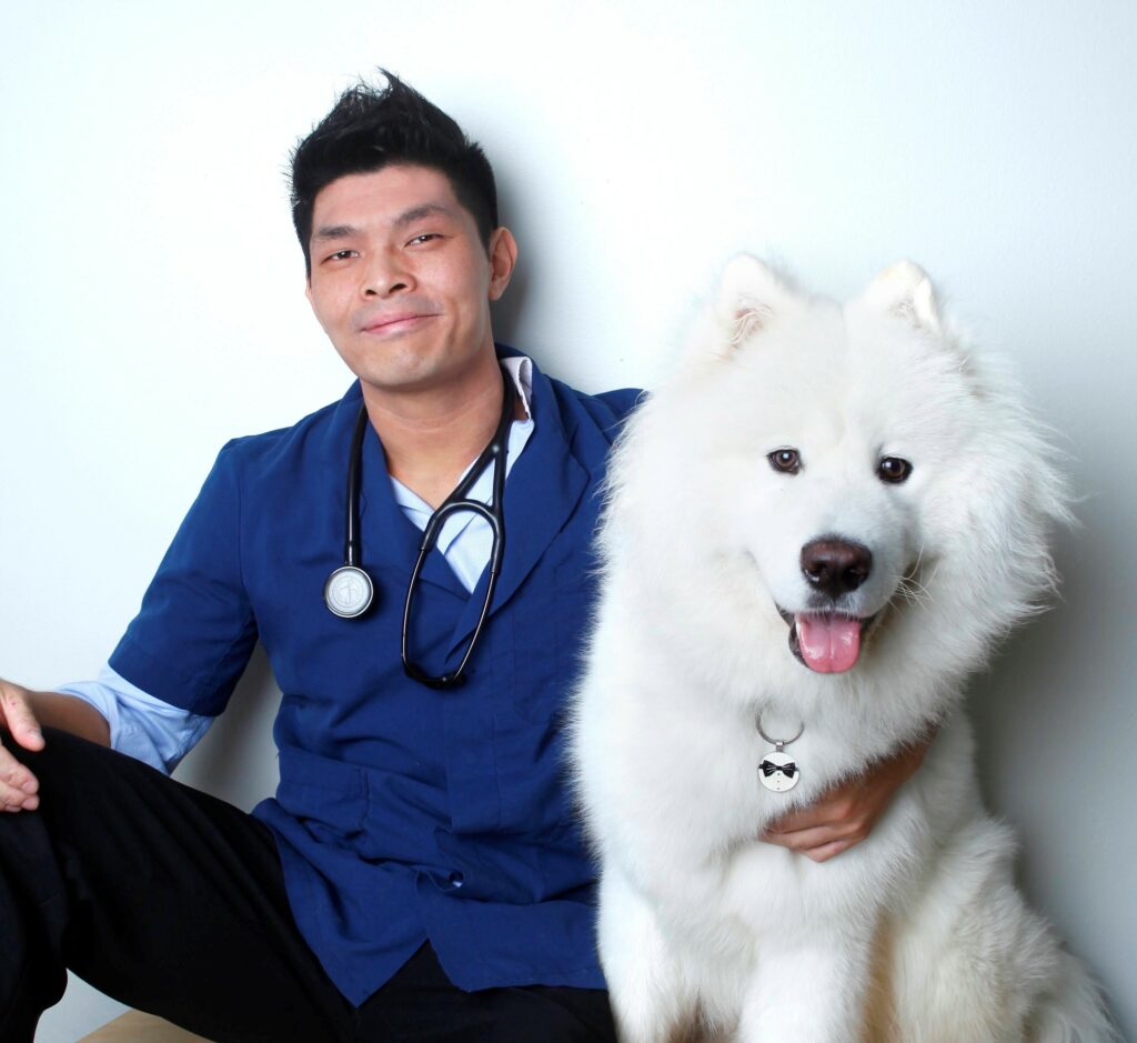 portrait of Dr Aaron Koey with dog