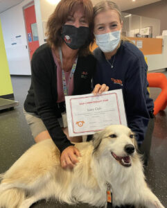 oncology team posing with border collie
