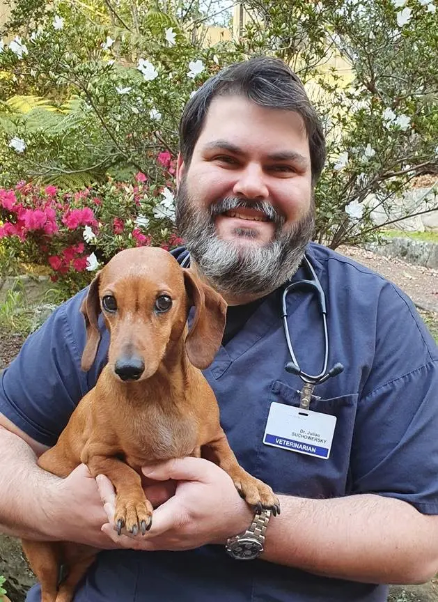 Portrait of Dr Julian Suchowersky and dog