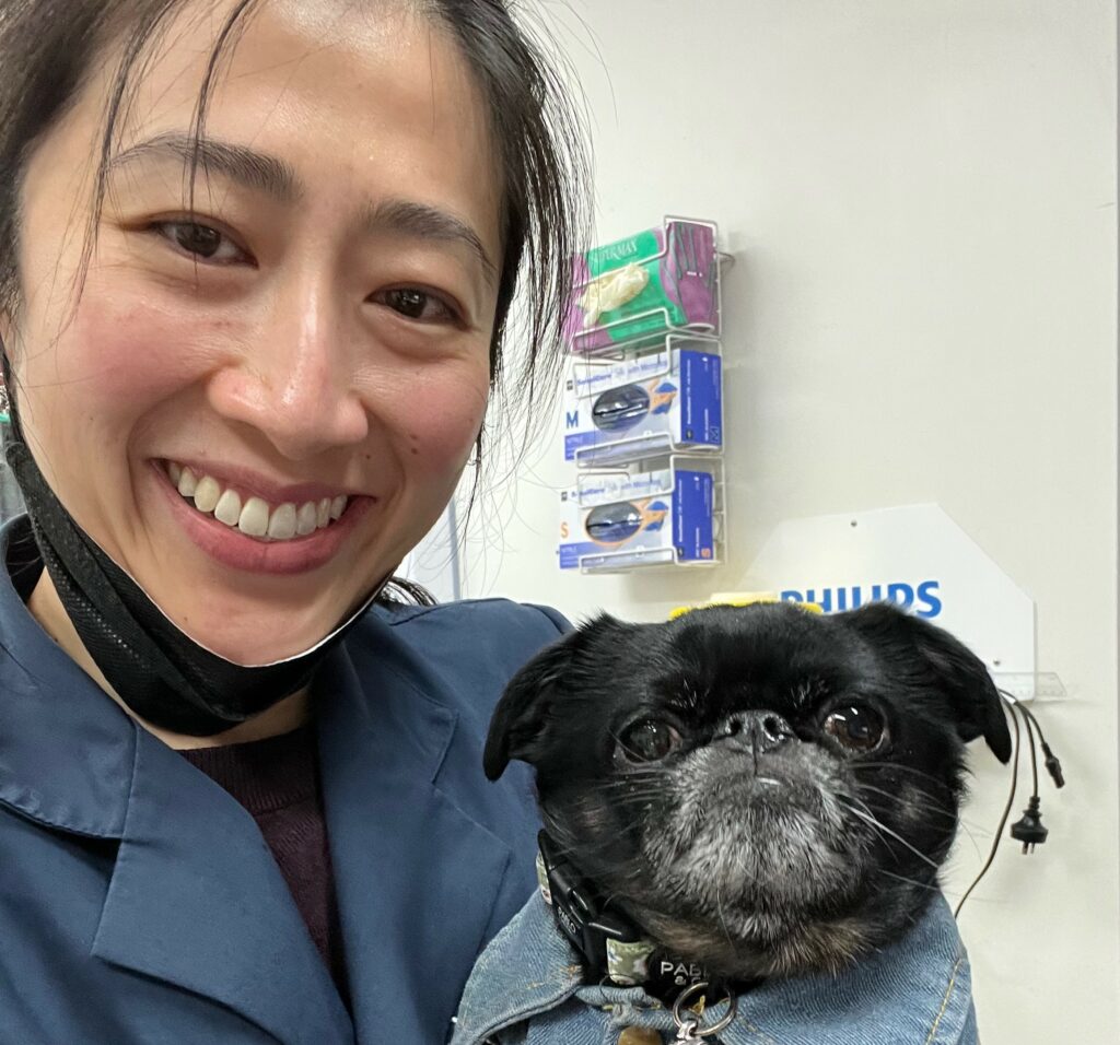 Portrait of Dr Jennifer Chau Diagnostic Imaging Specialist with dog